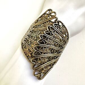 Silver tone floral clamper bangle bracelet